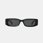 Glossy black polycarbonate rectangle sunglasses feature a broad squared frame, softly rounded corners, dark lenses, and wide temples for a sleek modern silhouette.