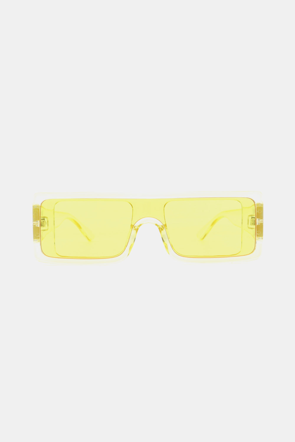 Translucent yellow polycarbonate rectangle sunglasses feature a broad, squared front, matching lenses, and a sleek structured frame with folded temples.