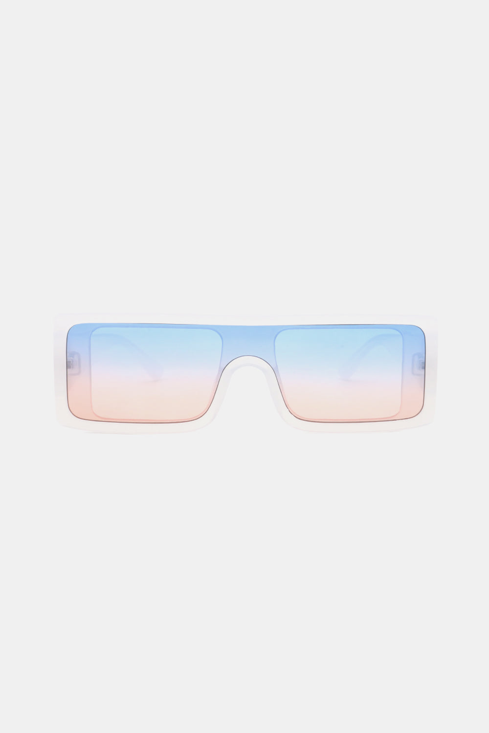 Translucent pale blue polycarbonate rectangle sunglasses feature a broad frame, squared lenses, and blue-to-pink gradient lenses for a modern statement silhouette.
