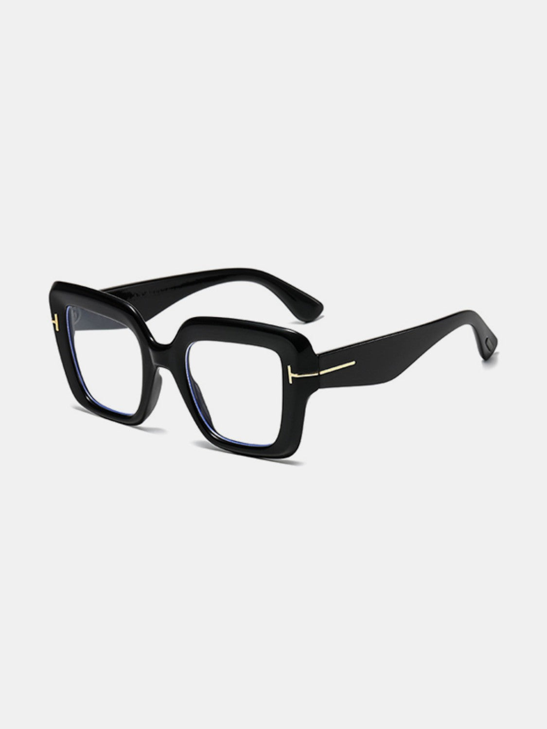 Black polycarbonate square sunglasses with softly rounded frames, broad temples, clear lenses, and a subtle gold-tone hinge accent shown at an angled view.