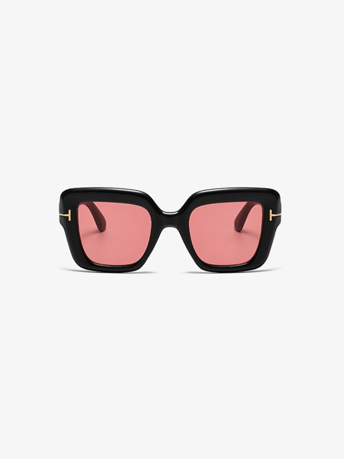 Black polycarbonate square sunglasses feature softly rounded frames, pink lenses, broad temples, and subtle gold-tone metal-look hinge accents.