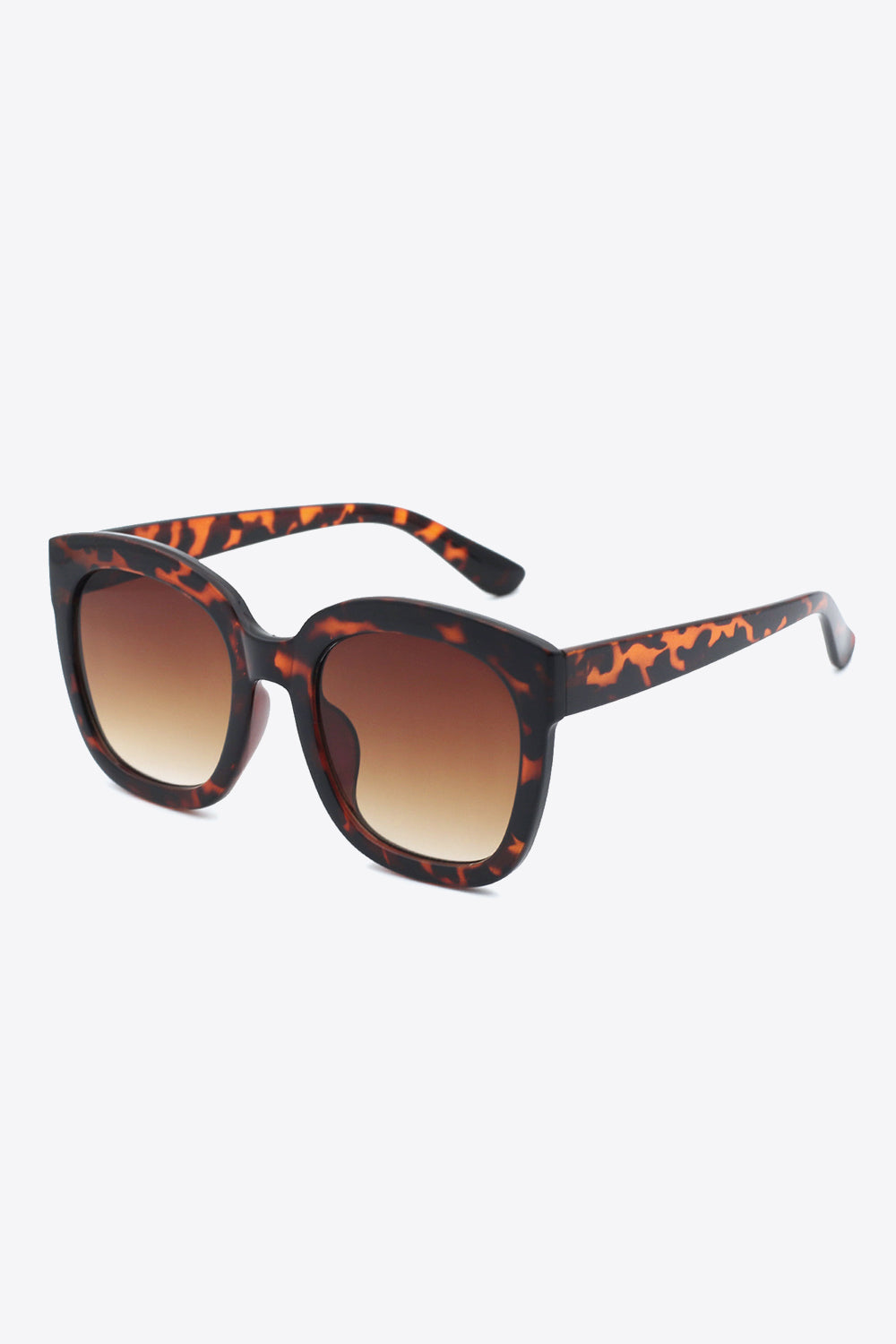 Square sunglasses with a substantial tortoiseshell polycarbonate frame, softly rounded silhouette, matching temples, and oversized gradient brown lenses.