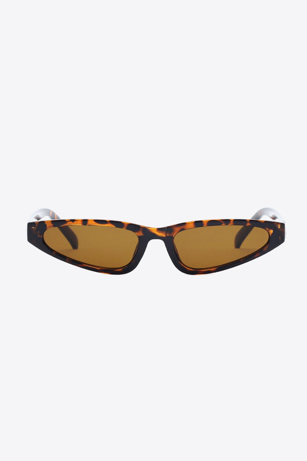 Tortoiseshell polycarbonate cat-eye sunglasses feature a sleek, gently upswept frame, warm brown acetate lenses, and structured matching temples.