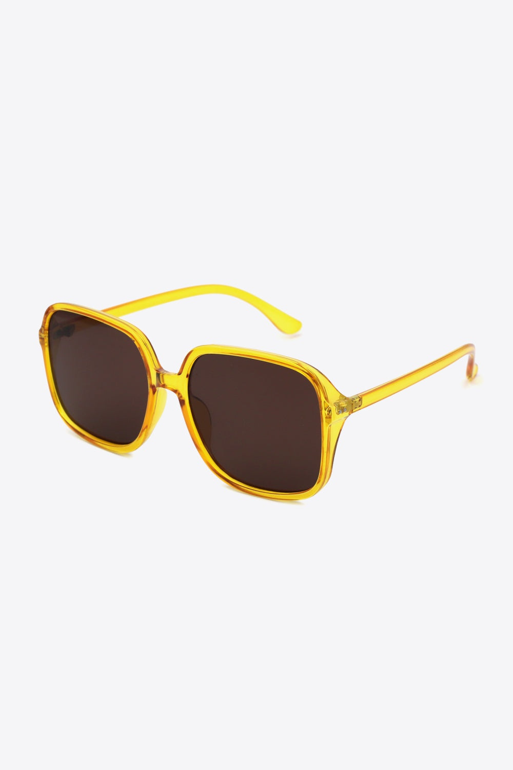 Translucent yellow polycarbonate square sunglasses feature broad dark lenses, softly rounded corners, a defined top line, and sleek curved temples.