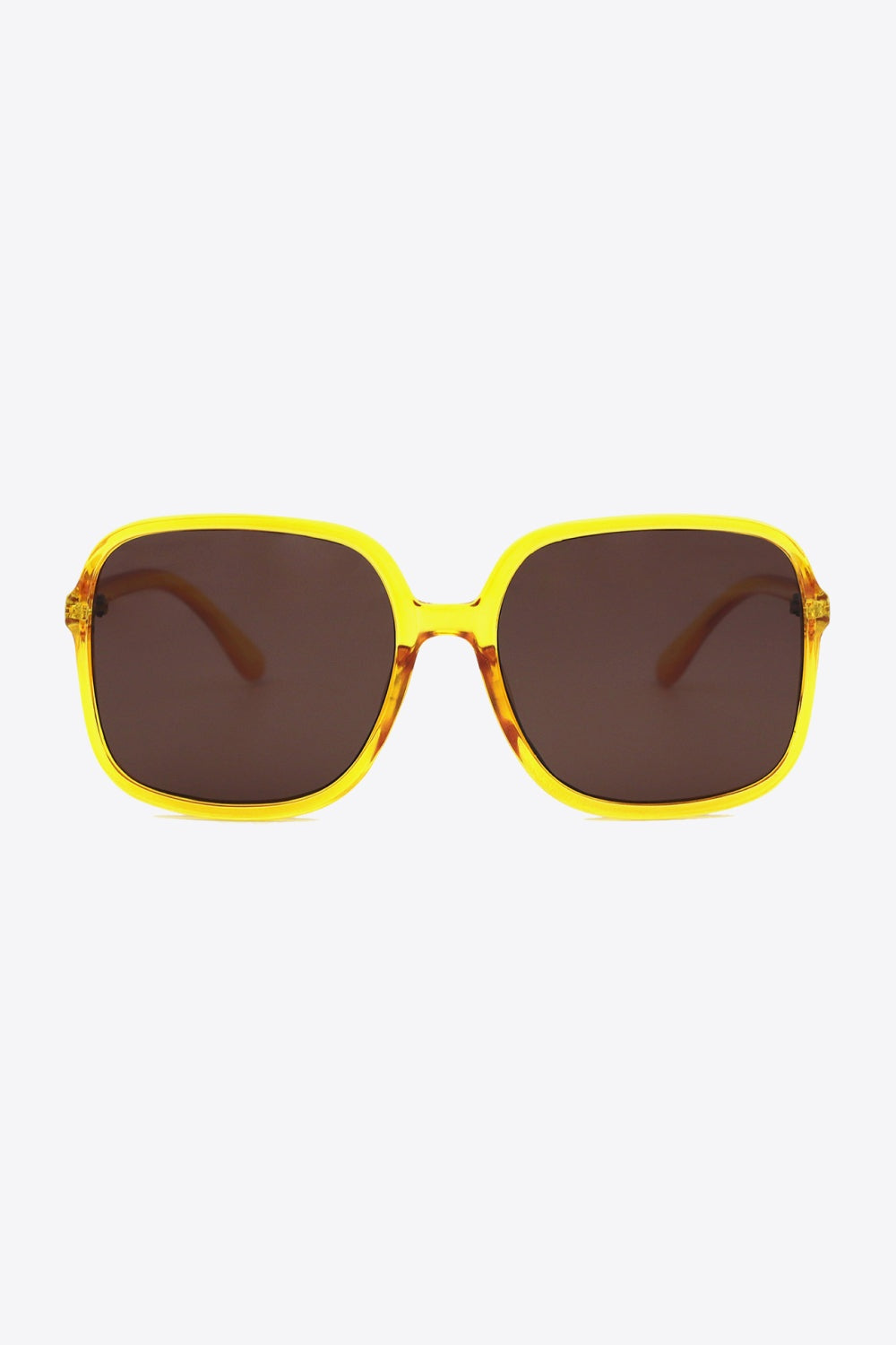 Bright yellow polycarbonate square sunglasses feature softly rounded frames, a defined top line, broad brown lenses, and sleek matching temples.