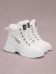 White PU leather lace-up combat boots feature plush fleece lining, metal eyelets, side zippers, padded collars, and chunky rubber soles with low heels.