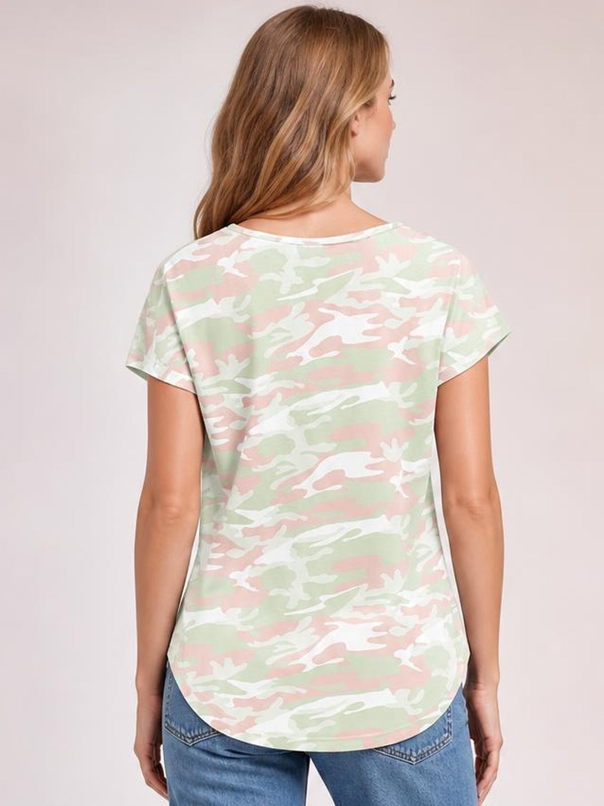 Model shown from the back wearing a pastel camouflage printed round-neck short-sleeve T-shirt with a relaxed silhouette and curved hem.