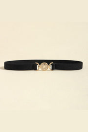 Black PU leather belt with a sleek 0.8-inch band and ornate gold-tone alloy circular buckle, shown flat to highlight its streamlined construction.