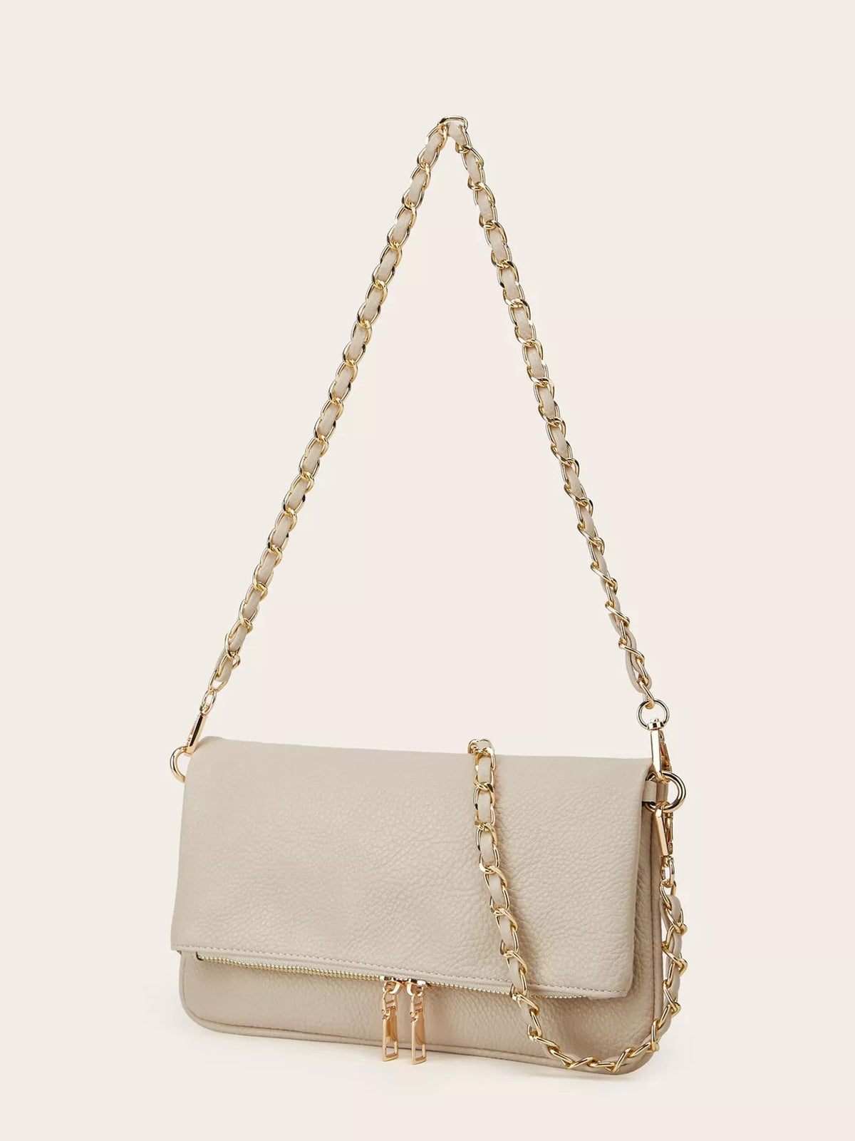 Medium beige PU leather shoulder bag with a flap front, gold chain strap, rounded silhouette, and front zippered pocket with double pulls.