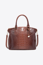Medium brown PU leather handbag with a structured silhouette, crocodile-embossed texture, rounded top handles, zip-top closure, and an attached shoulder strap.