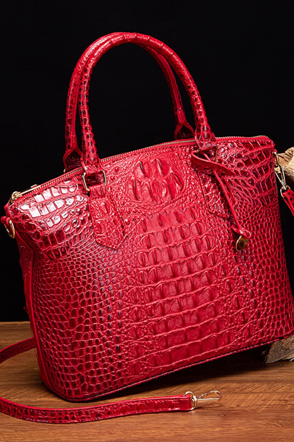 A red medium PU leather handbag with a structured silhouette, rounded top handles, crocodile-inspired embossed texture, zip closure, and removable shoulder strap.
