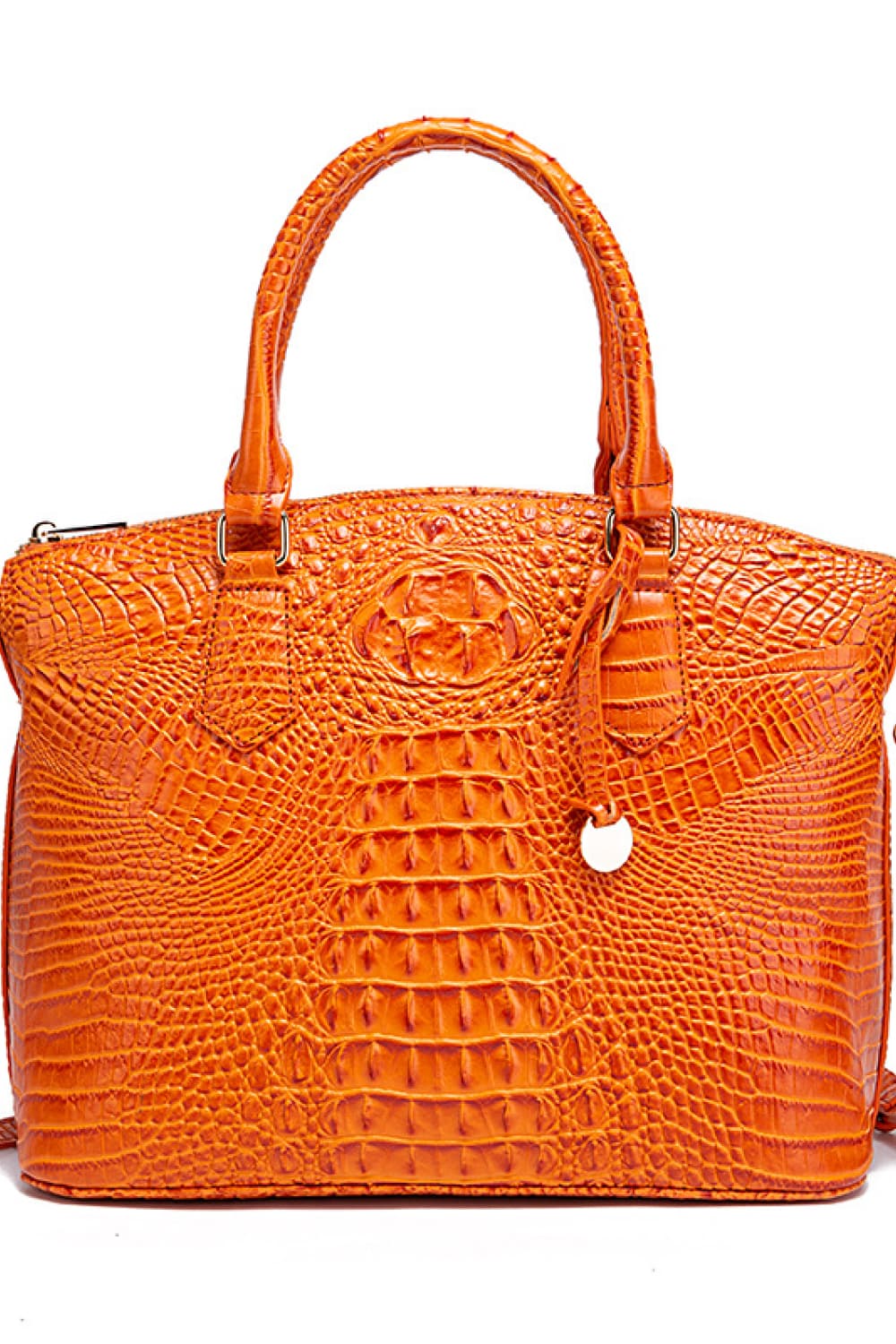 A medium orange PU leather handbag with a structured silhouette, rounded top handles, embossed crocodile-inspired texture, and a decorative hanging charm.