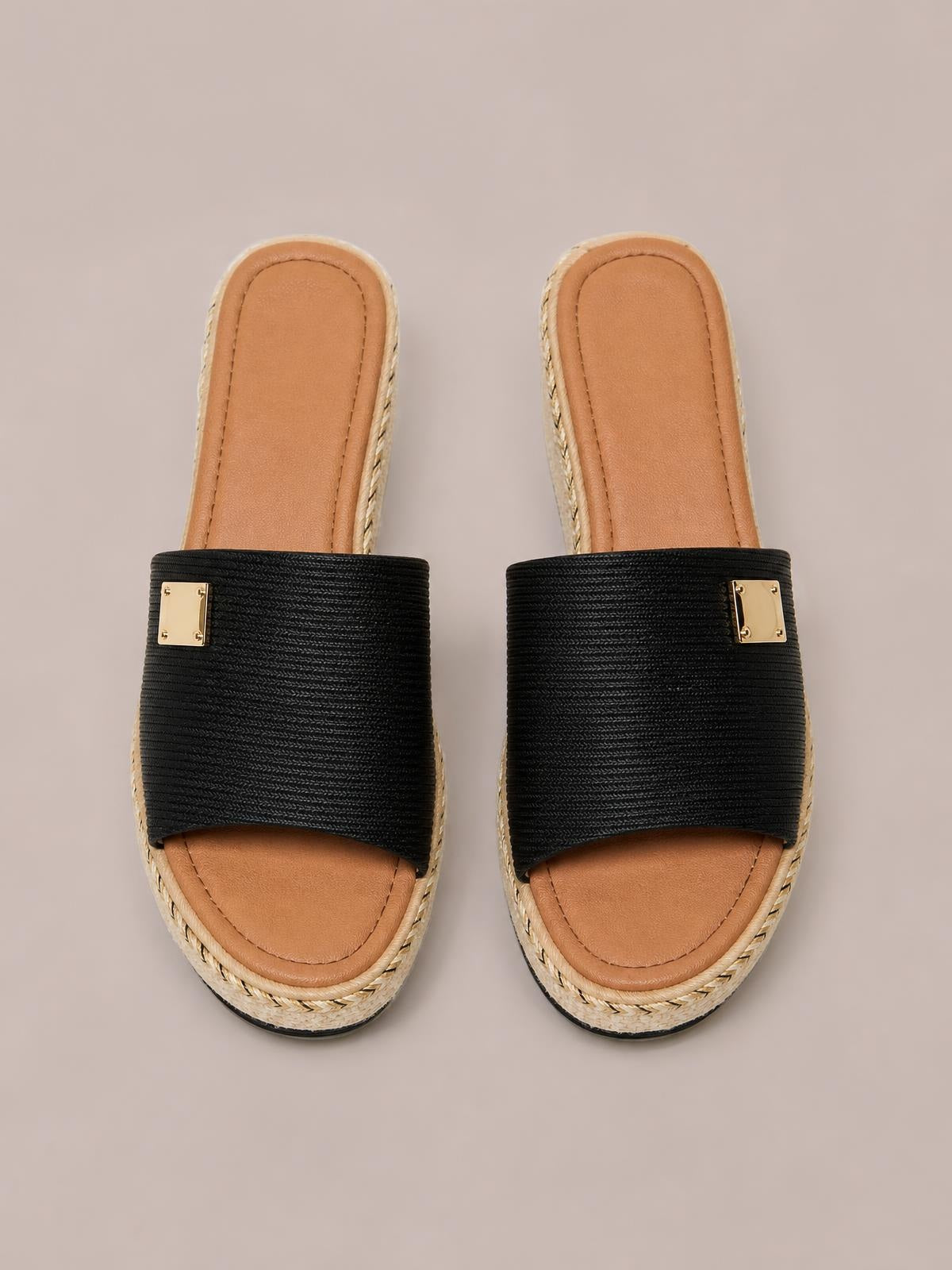 Black PU leather open-toe sandals feature wide textured straps, gold square accents, tan footbeds, and braided trim around the mid-height soles.