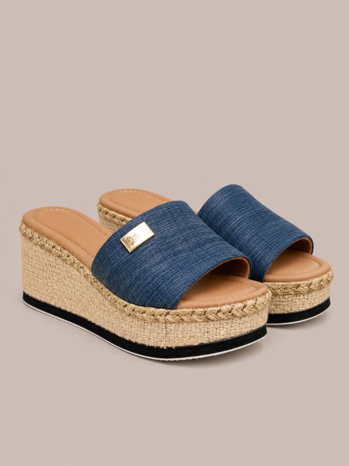 Blue PU leather open-toe sandals feature wide textured straps, gold accents, and natural woven wedge platforms with braided trim and black soles.