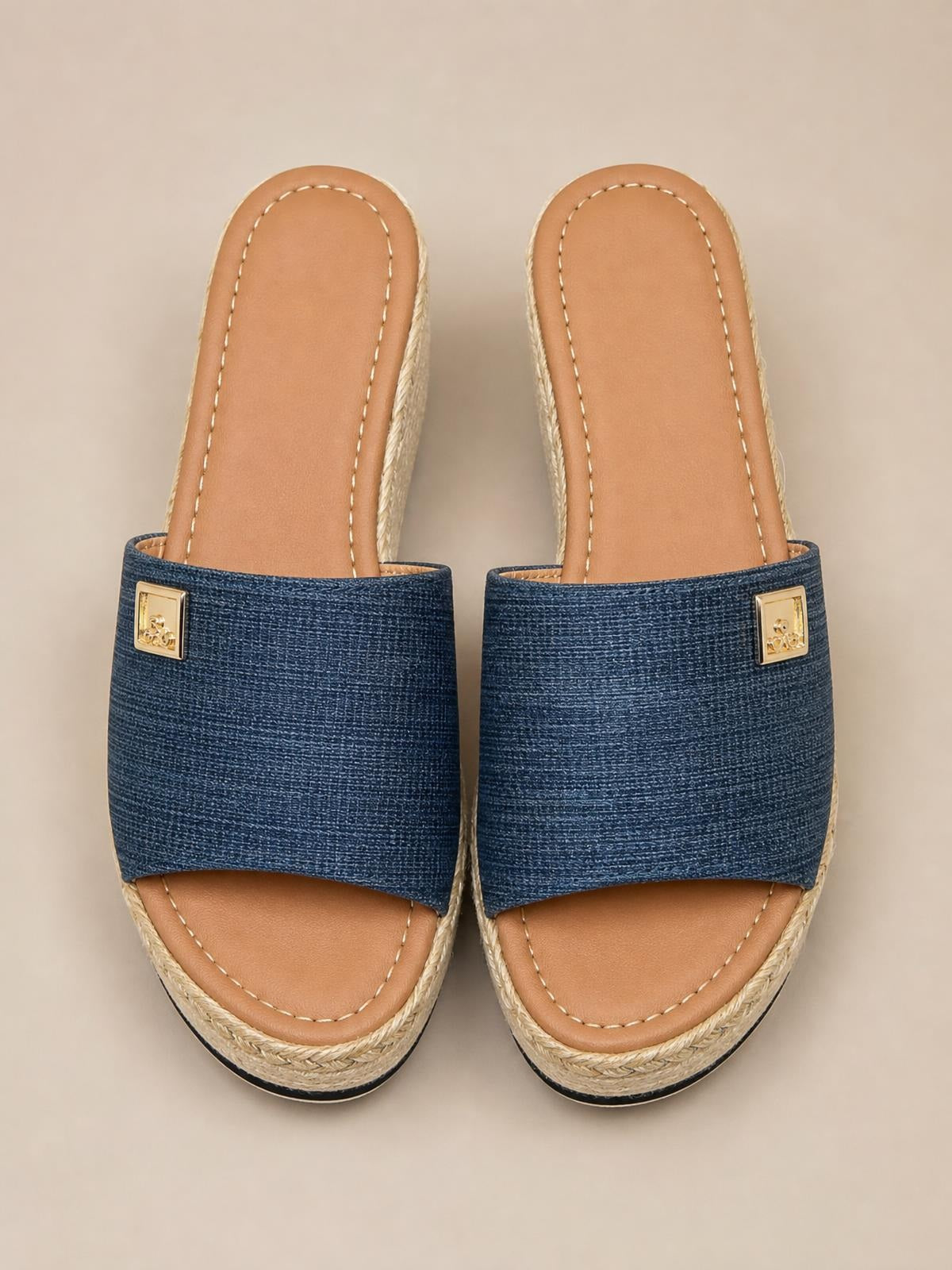 Blue PU leather open-toe sandals feature wide textured straps, gold square accents, tan stitched footbeds, and rope-wrapped mid-heel wedge soles.