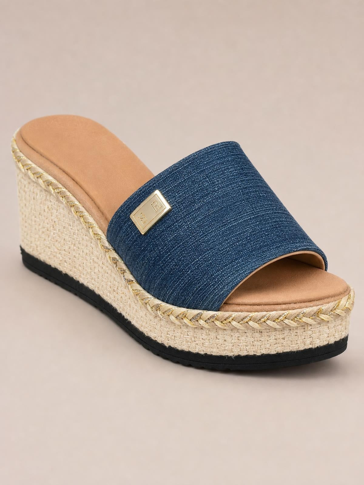 Navy PU leather open-toe sandals feature a wide textured vamp, gold rectangular ornament, braided trim, and a woven mid-height wedge platform sole.
