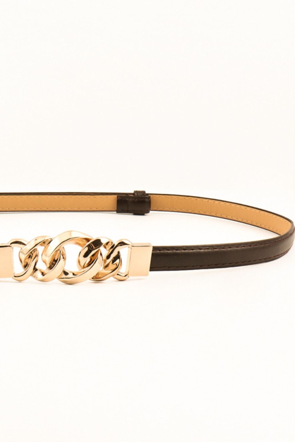 Slim dark brown PU belt with stitched edges and a sculptural gold-tone chain-link zinc alloy buckle for a polished waist-defining accent.