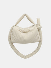 Cream puffy nylon medium crossbody bag with a softly rounded silhouette, padded construction, zip-top opening, short handle, and long gathered strap.