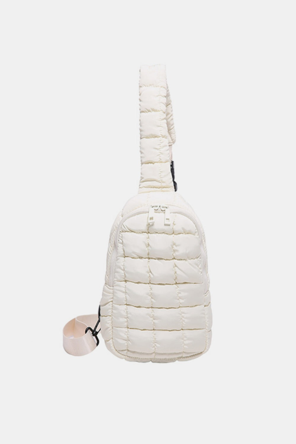 Ivory quilted nylon crossbody bag with a softly padded grid pattern, rounded rectangular silhouette, top zip closure, and adjustable strap.