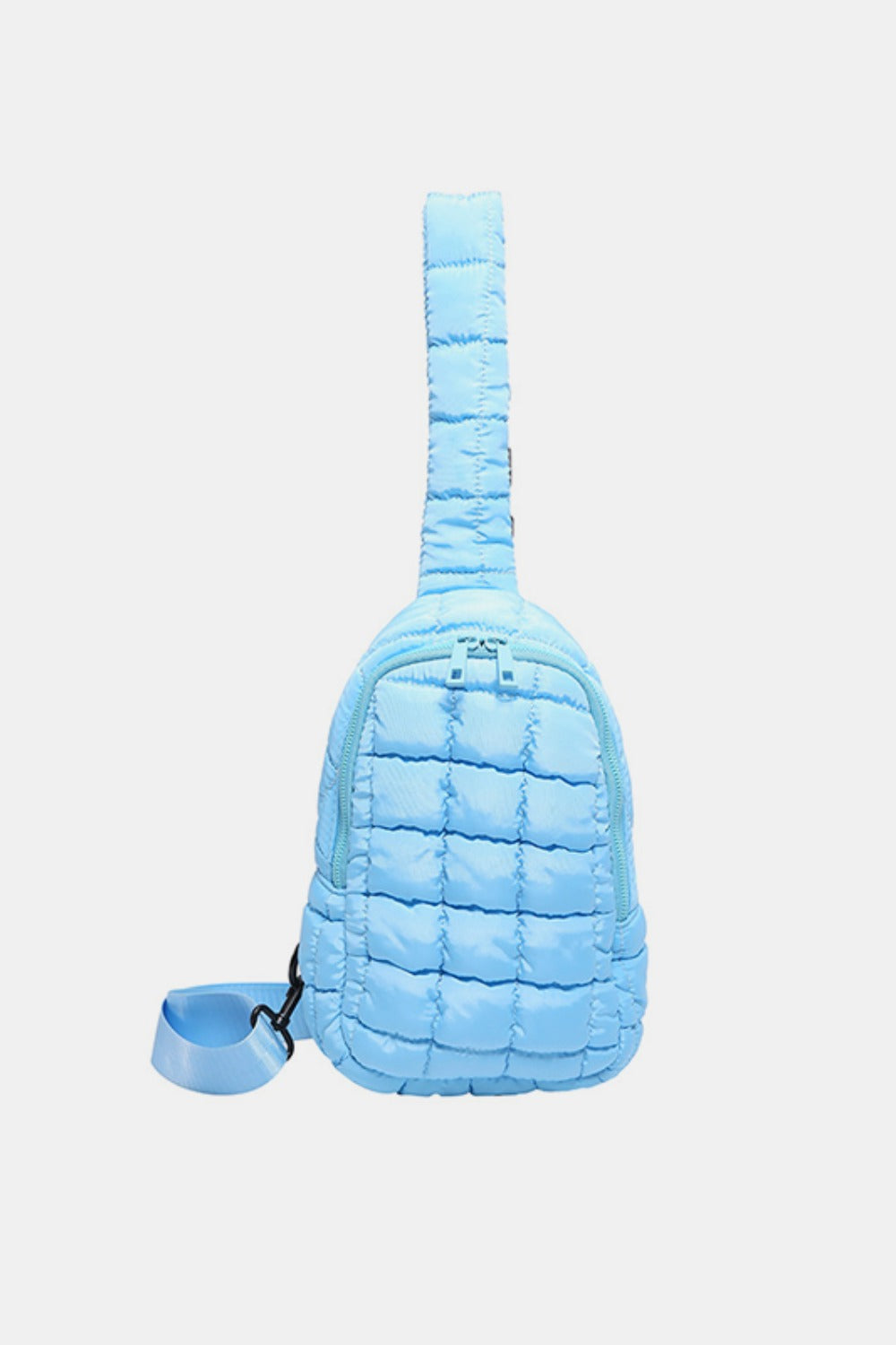 A light blue quilted nylon crossbody bag features a softly padded grid pattern, rounded compact silhouette, top zipper, and adjustable shoulder strap.