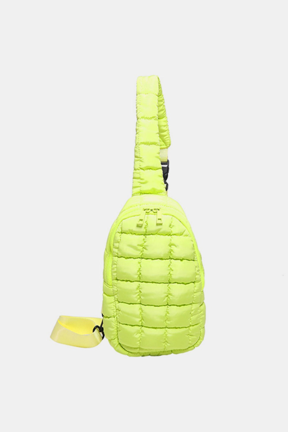 A neon lime quilted nylon crossbody bag features a softly padded grid pattern, rounded elongated silhouette, zippered opening, and adjustable strap.