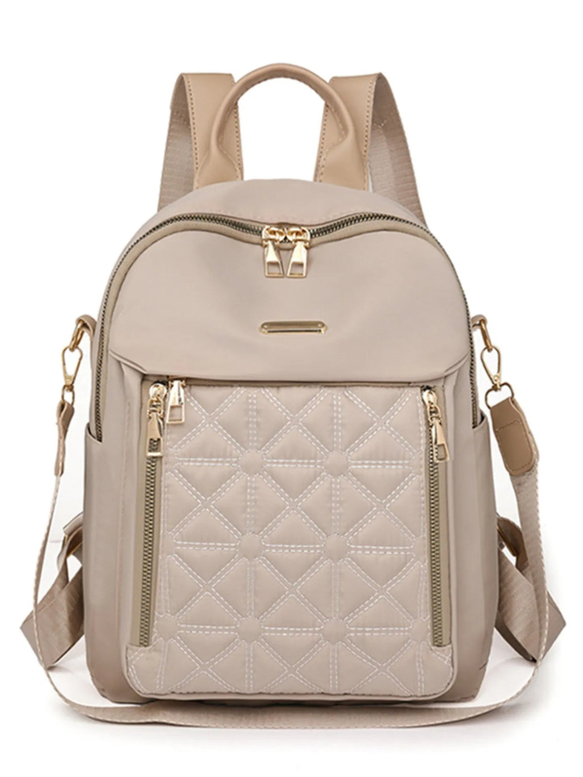A medium beige Oxford cloth backpack with a structured silhouette, quilted diamond-stitched front pocket, dual top zippers, adjustable shoulder straps, and gold-tone hardware.