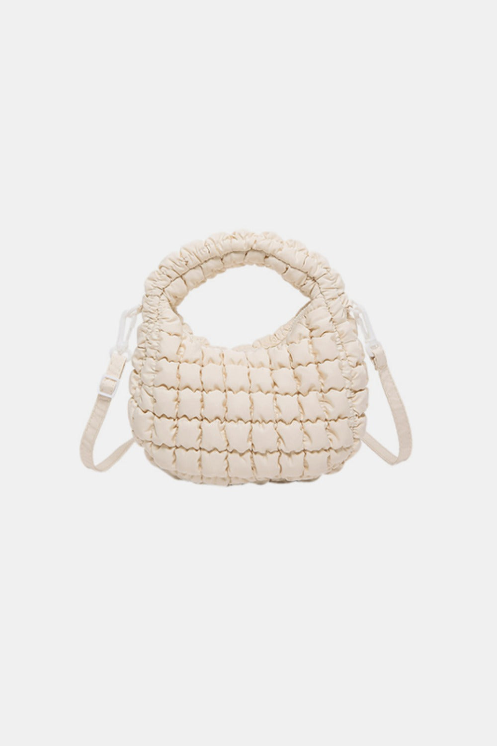 Cream quilted puffy crossbody bag with a rounded silhouette, gathered construction, padded top handle, and removable shoulder strap.