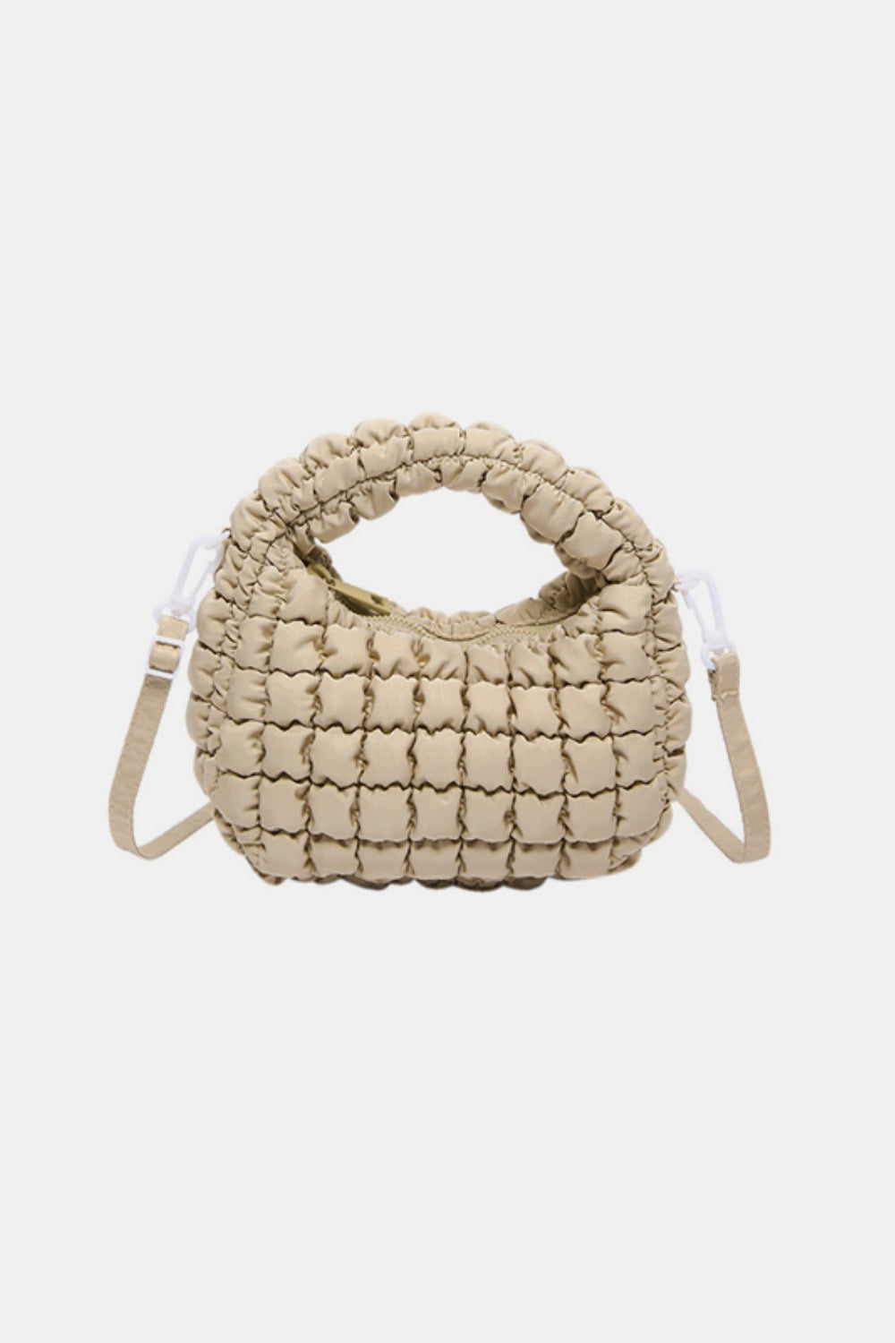 Beige quilted puffy crossbody bag with a rounded silhouette, padded top handle, gathered texture, and attached removable strap.