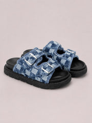 Blue checkered cloth buckle sandals feature raw edges, silver-tone adjustable straps, open toes, and sturdy flat black rubber soles.