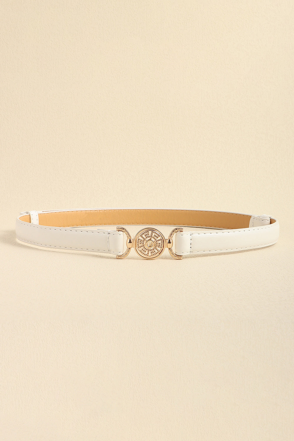 Slim white PU leather belt with stitched construction and an ornate circular alloy buckle accented by rhinestone decoration.