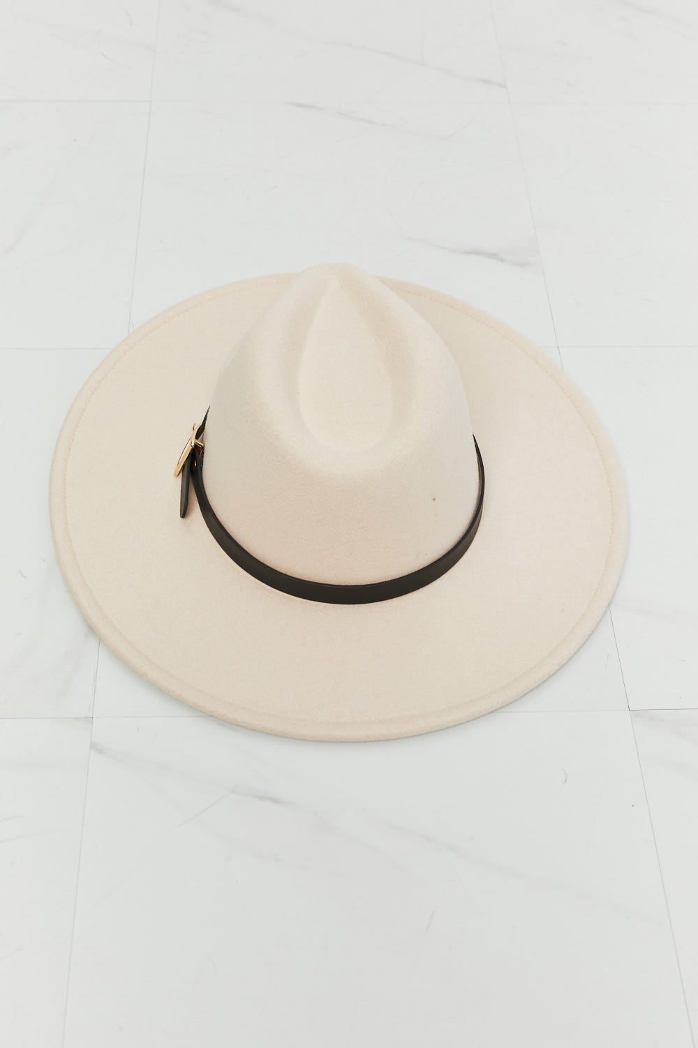 Soft beige Ride Along fedora hat with a structured crown, wide 3.5-inch brim, black contrast band, and gold buckle accent.