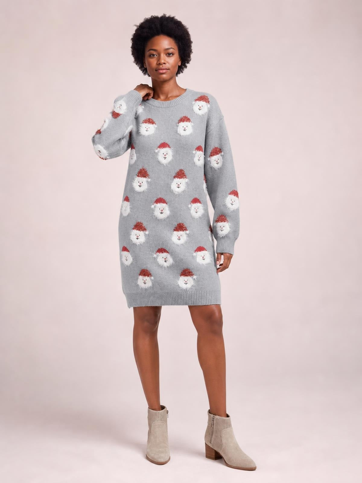 Model wears a gray round neck sweater dress with dropped shoulders, long sleeves, ribbed cuffs and hem, relaxed straight silhouette, and Santa face pattern.