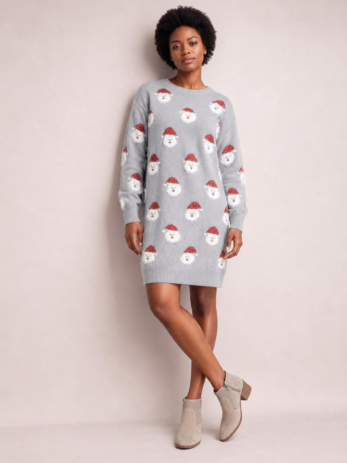 Model wears a gray round-neck dropped-shoulder sweater dress with long sleeves, ribbed trim, Santa face pattern, and a relaxed above-knee silhouette.