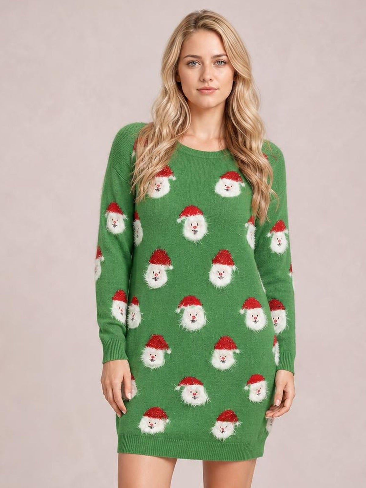 Model stands facing forward in a green round-neck dropped-shoulder sweater dress with long sleeves, ribbed cuffs and hem, and a Santa face pattern.