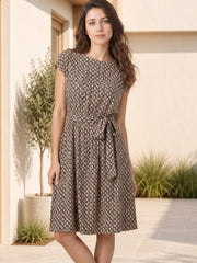 Model wears a camel printed tie-waist dress with a round neck, short regular sleeves, knee-length A-line silhouette, and defined waist.