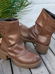 Brown PU leather ankle boots with round toes, low block heels, stitched panel construction, and textured rubber soles shown from multiple angles.
