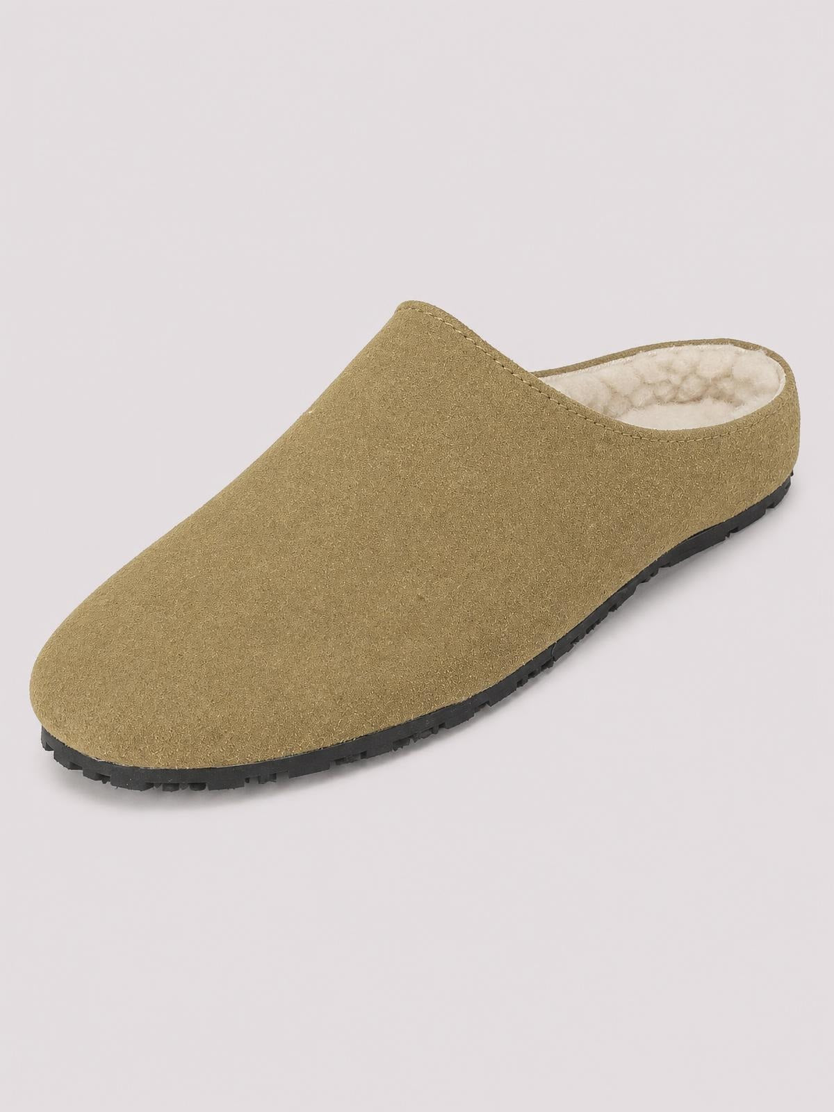 Olive suede round-toe slipper with a slip-on mule silhouette, light plush lining, stitched edges, and a flat black rubber sole.