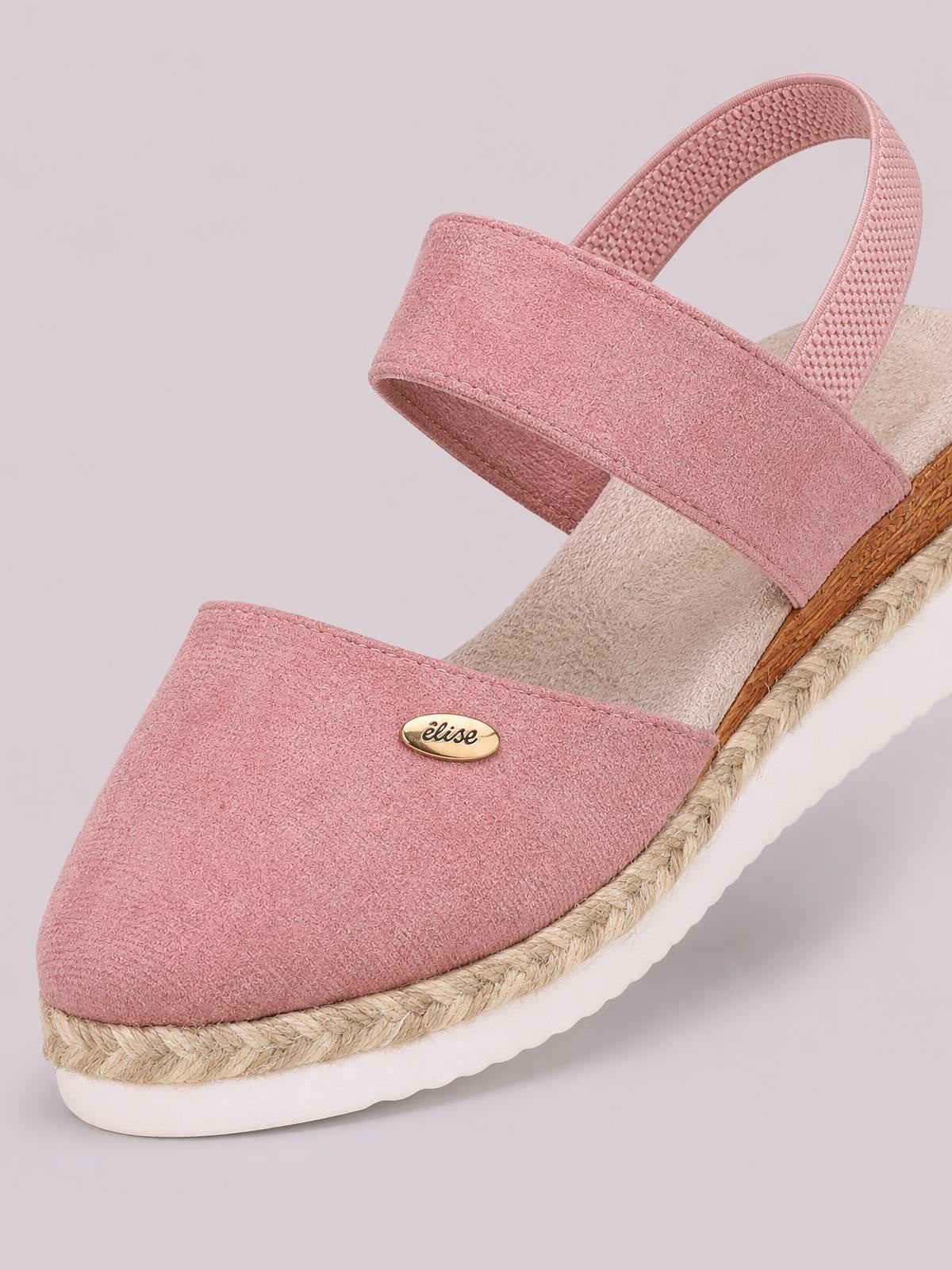 Pink canvas round toe wedge sandals with wide straps, cushioned footbed, braided espadrille trim, and a white rubber platform sole.