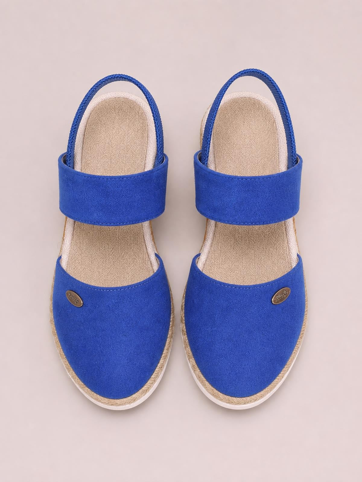 Bright blue round toe wedge sandals with wide canvas straps, slingback ankle straps, cushioned footbeds, and natural rope-style mid-height soles.