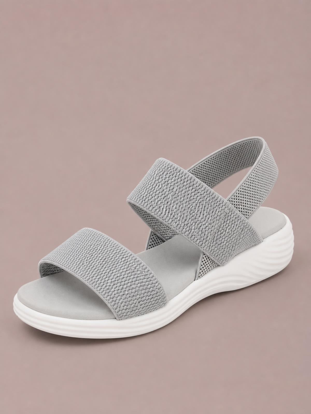 Gray rubber open-toe low heel sandal with two wide textured straps, a cushioned footbed, slingback design, and a gently raised platform sole.