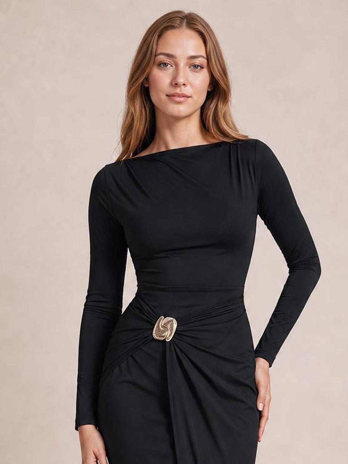 Model poses in a black long-sleeve bodycon dress with a fitted silhouette, ruched waist, and decorative gold button detail.