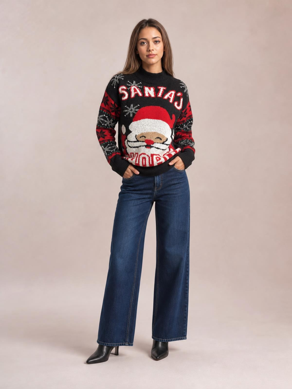 A model wears a black Santa mock neck long sleeve sweater with festive red-and-white graphics, ribbed cuffs and hem, standing with hands in her pockets.