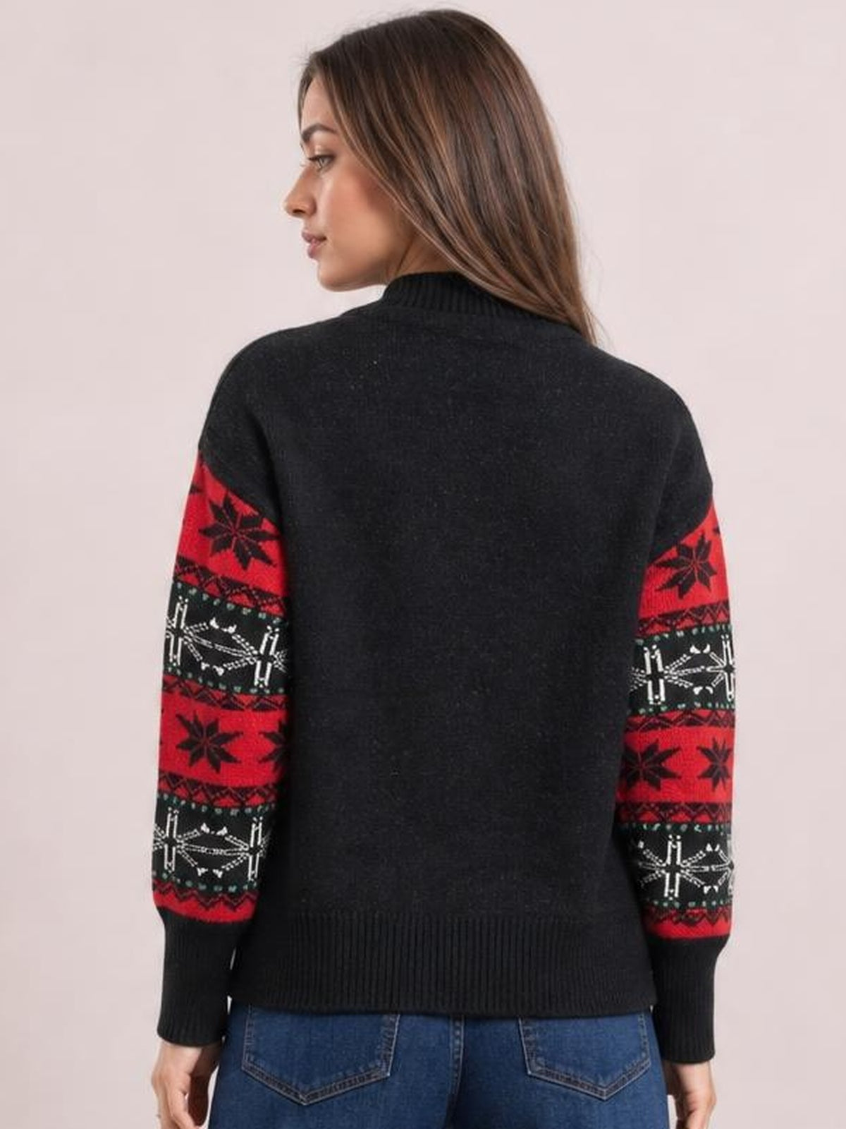 Model shown from the back in a black Santa mock neck long sleeve sweater with red and white patterned sleeves, ribbed cuffs, collar, and hem.