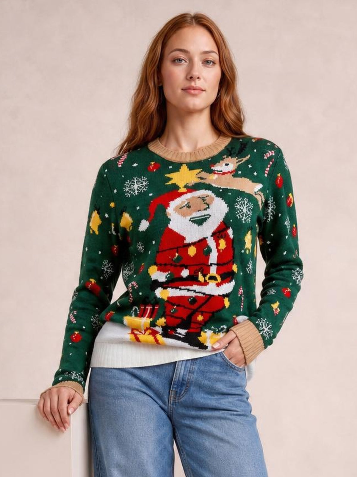 A woman wears a dark green Santa round-neck long-sleeve sweater with a relaxed silhouette, ribbed cuffs and hem, and festive holiday motifs.