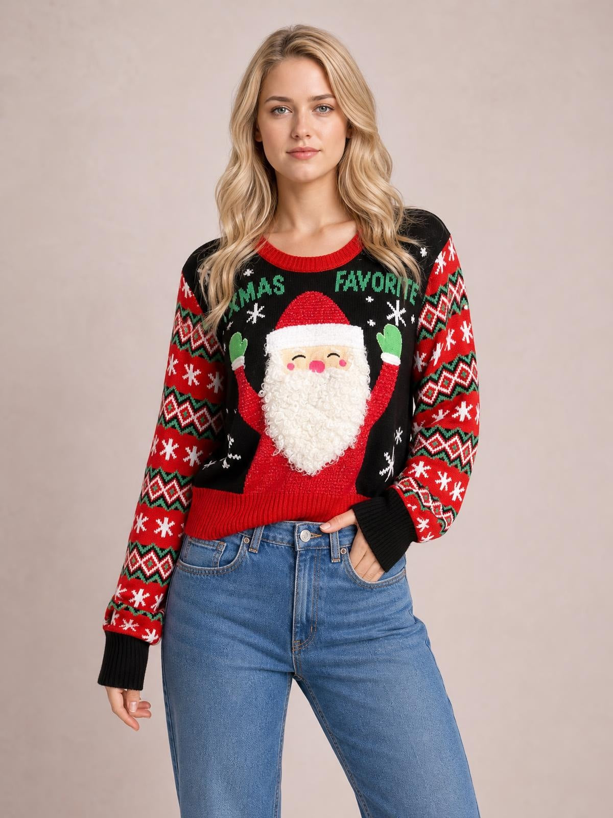 Model wearing a black SANTA’S FAVORITE graphic long sleeve sweater with a Santa design, red Fair Isle sleeves, ribbed cuffs and hem, posed with one hand in her jeans pocket.