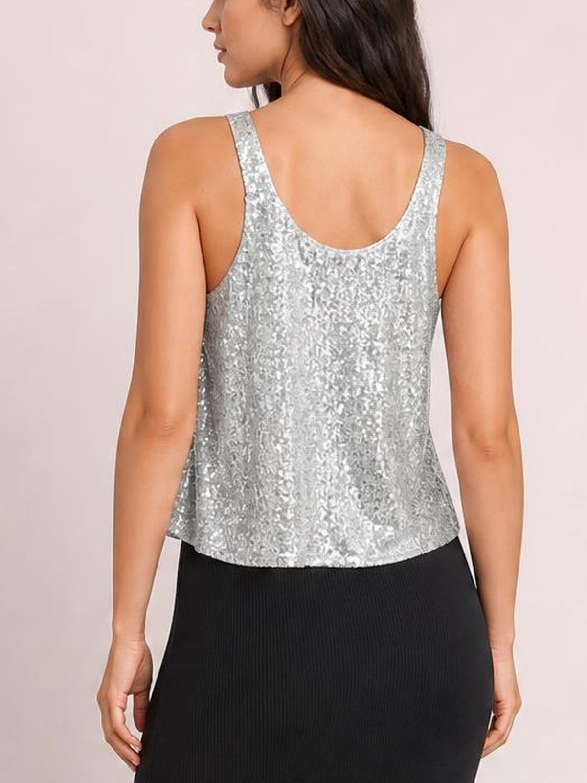 Model shown from behind in a silver sequin tank with wide shoulder straps, a scoop back neckline, and a relaxed straight silhouette.