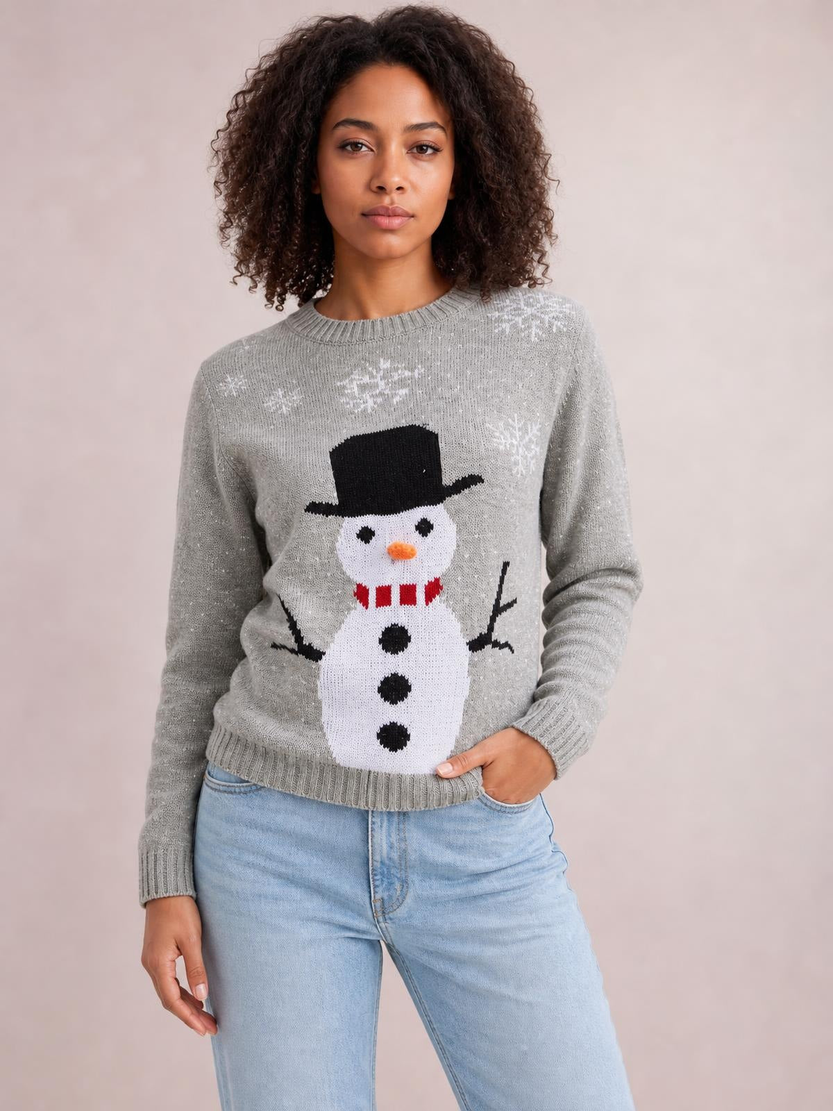 Model wearing a gray snowman graphic sweater with long raglan sleeves, ribbed crew neckline, cuffs and hem, shown in a relaxed standing pose.
