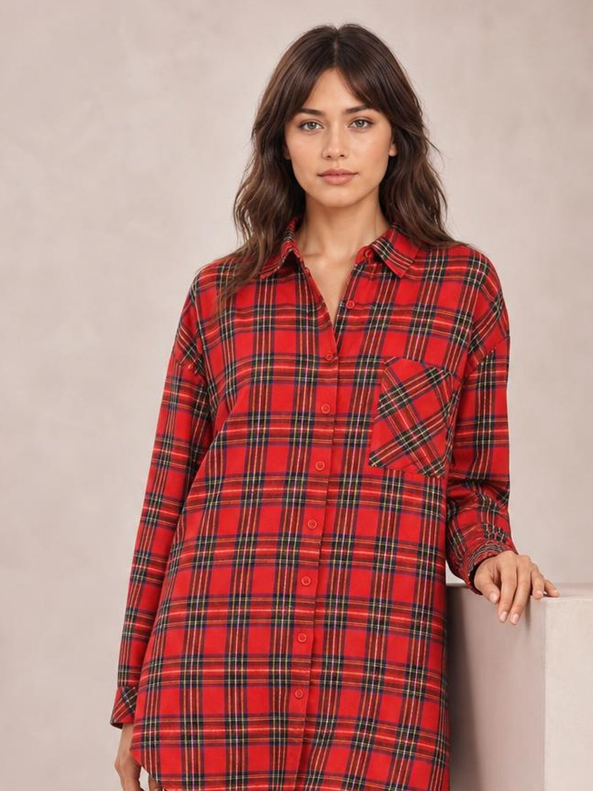 Model wears a red Christmas checker plaid shirt dress with a button-down front, long sleeves, chest pocket, and relaxed oversized silhouette.