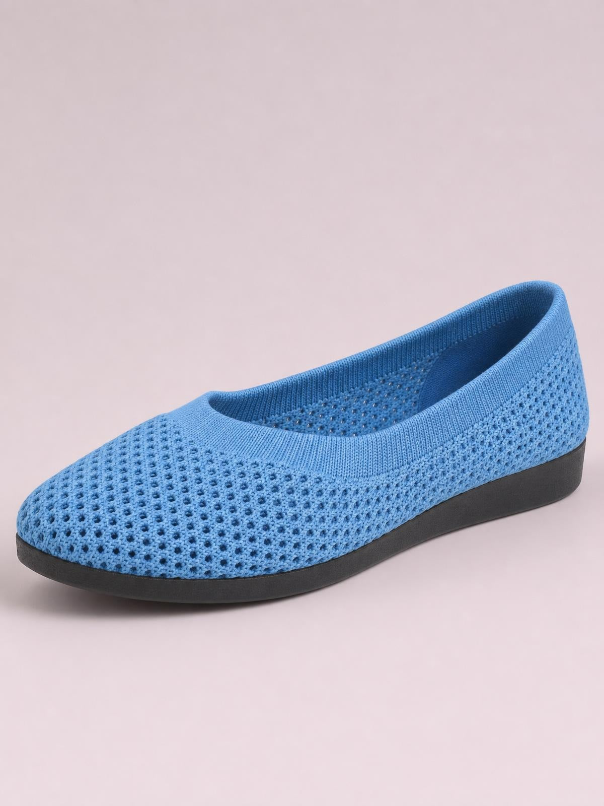 Blue solid-color mesh flat slip-on with a rounded toe, elastic knit collar, breathable openwork construction, and a low black rubber sole.