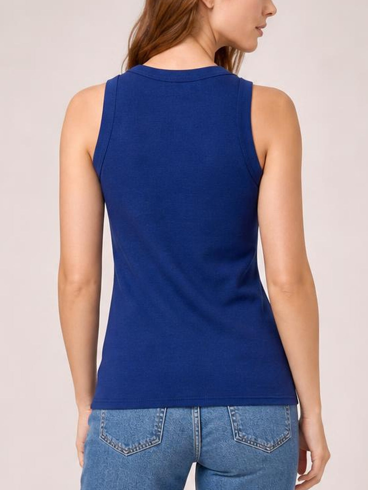 Model shown from the back in a solid royal blue round neck tank with wide shoulder straps, a fitted silhouette, and straight hem.